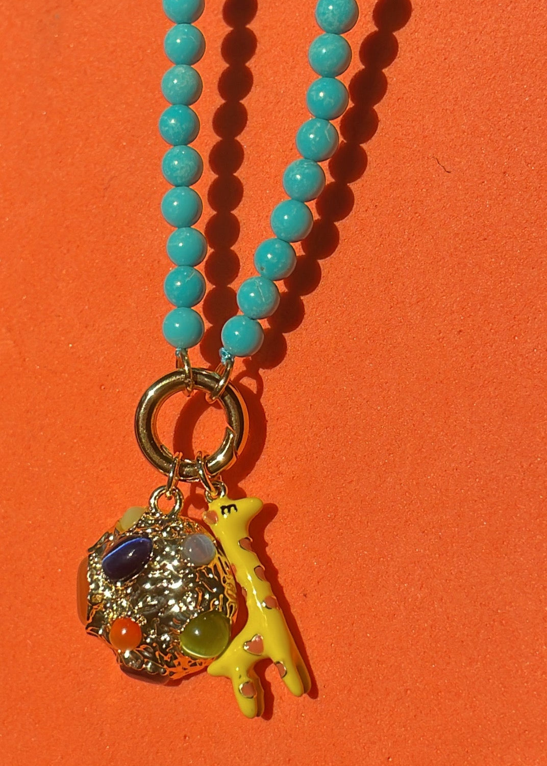 GOLD WITH STONES ROUND PLANET CHARM